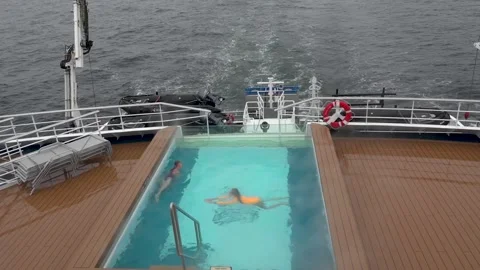Young Passengers Swimming in an Open Pool on Cruise Ship in Antarctica Stock Footage 344548856