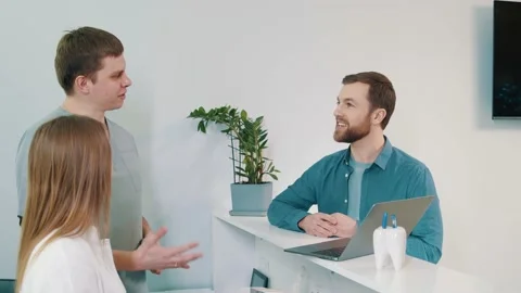 Young patient communicates with doctors on the reception desk. Dentistry Video stock 235911455