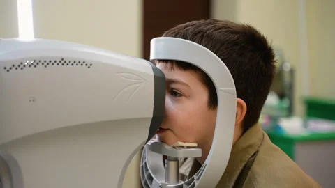 Young patient undergoing comprehensive eye examination Stock Footage 310805648