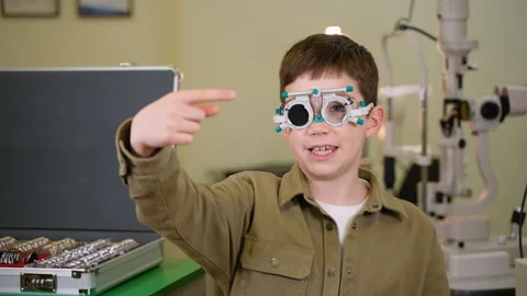 Young patient undergoing eye examination pointing in different directions Stock Footage 310810088