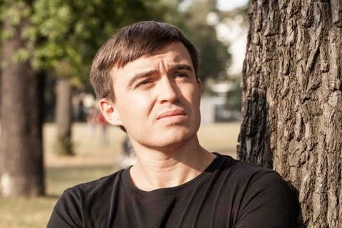 Young pensive man Stock Photos