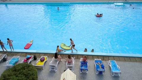 Young people are having fun by the pool Stock Footage 106578355