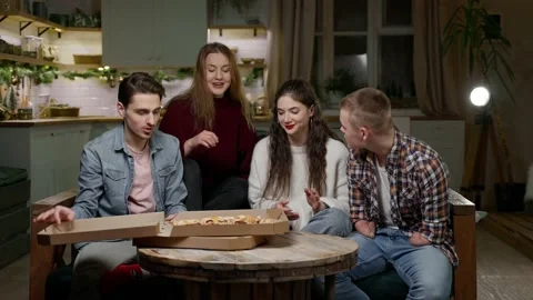 Young people are sorting out slices of pizza Stock-Footage 167918966