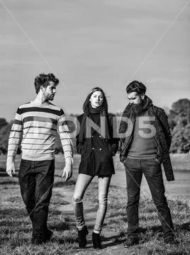 Young people in autumn park Stock Photos