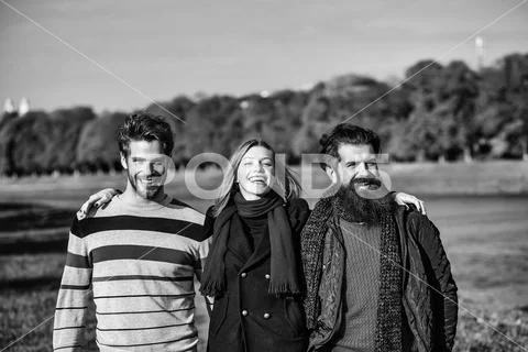 Young people in autumn park Stock Photos