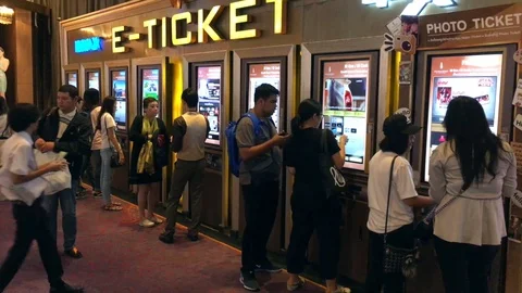 Young people buy e tickets at Krungsri IMAX Theater (Paragon Cineplex) Stock Footage 86573673