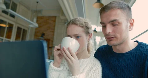 Young people chatting in a cafe Stock Footage 87863393