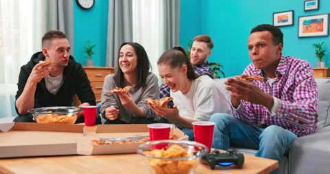 Young people cheerful men and women are eating cheesy pizza, chatting relaxing 스톡 동영상 152402353