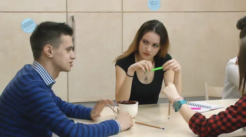 Young people communicate with each other at the table Stock Footage 63364537