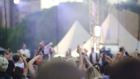 Young people dancing and having fun at music festival on summer evening outdoors Stock Footage 123216558