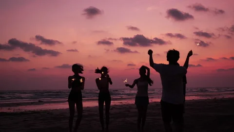 Young people dancing and playing firework summer Stock Footage 187397333