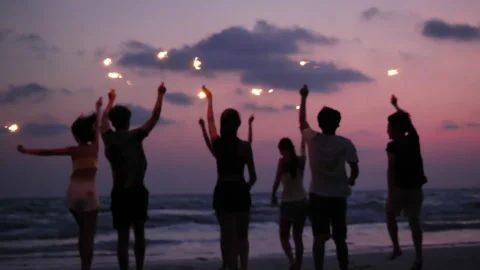 Young people dancing and playing firework summer Stock Footage 187397657