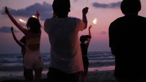 Young people dancing and playing firework summer Stock Footage 187404525