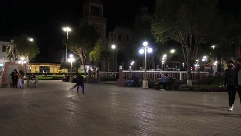 Young people dancing doing pirouettes on the ground in the main square of Huaraz Stock Footage 164572608