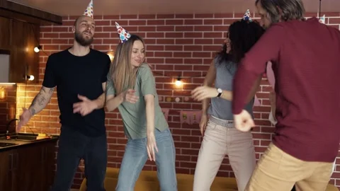 Young people dancing out rocking birthday party celebrating exciting holiday at Stock Footage 156911553