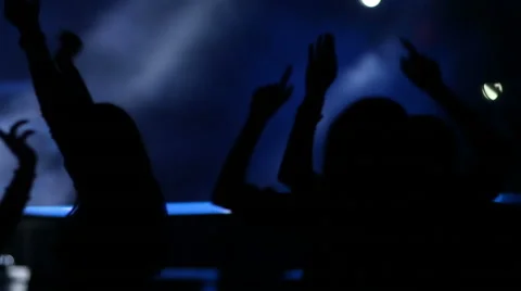 Young people dancing on the stage, crowd partying at a rock concert 動画素材 65663365