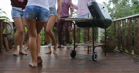 Young People Dancing While Cooking Barbecue Frineds Group Gathering On Summer Stock Footage 79588906