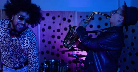 Young people dancing while mixing new album inside boutique recording studio Stock-Footage 153404572