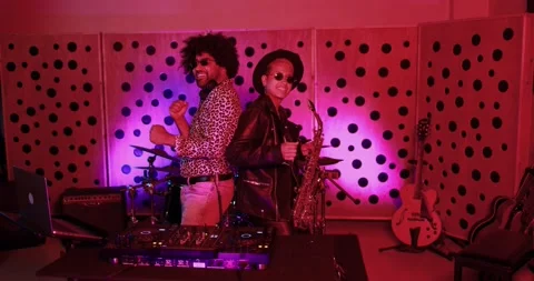 Young people dancing while mixing new album inside boutique recording studio Stock Footage 153404614