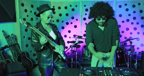 Young people dancing while record music inside a recording studio Stock Footage 153404756