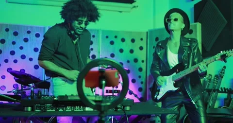 Young people dancing while recording music inside boutique  studio Stock Footage 153404711