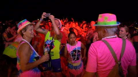 Young people from different countries dancing on the beach under the moon Stock Footage 106810928