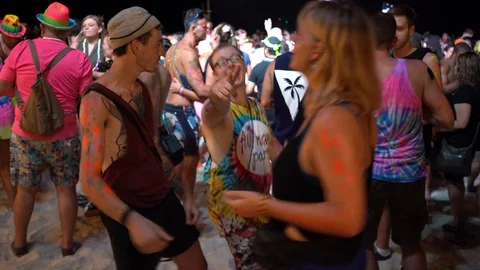 Young people from different countries dancing on the beach under the moon Stock Footage 106811092