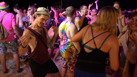 Young people from different countries dancing on the beach under the moon Stock Footage 106811235