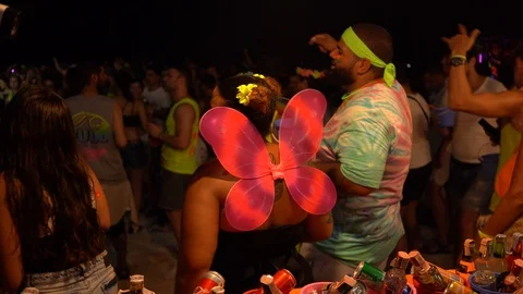 Young people from different countries dancing on the beach under the moon Stock Footage 106811438