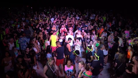 Young people from different countries dancing on the beach under the moon Stock Footage 106812165