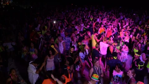 Young people from different countries dancing on the beach under the moon Stock Footage 106812185