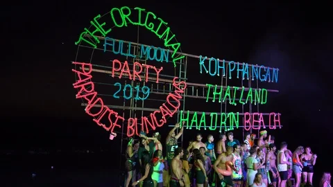 Young people from different countries dancing on the beach under the moon Stock Footage 106822470