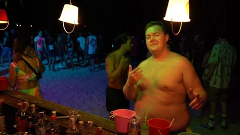 Young people from different countries dancing on the beach under the moon Stock Footage 106822661