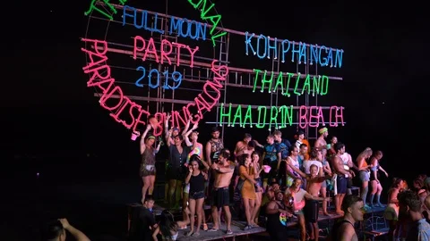 Young people from different countries dancing on the beach under the moon Stock Footage 106822717