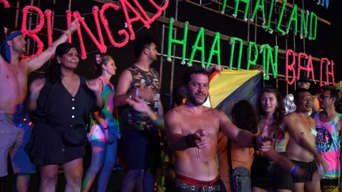 Young people from different countries dancing on the beach under the moon Stock Footage 106822968