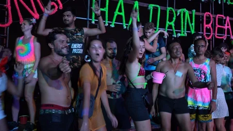 Young people from different countries dancing on the beach under the moon 스톡 동영상 106823290