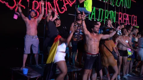 Young people from different countries dancing on the beach under the moon Stock Footage 106823293