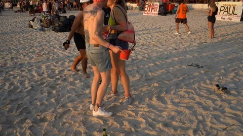 Young people from different countries meet the sunrise on Haad Rin beach Vídeos de archivo 106970306