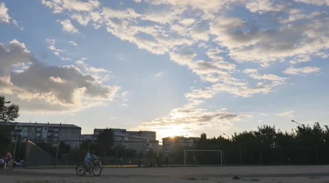 Young people do sport in the stadium at sunset Stock Footage 66076216
