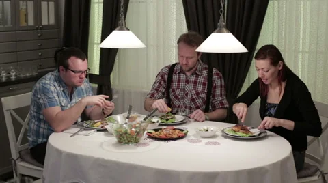 Young people eating in the cafe at the table Stock Footage 62845856