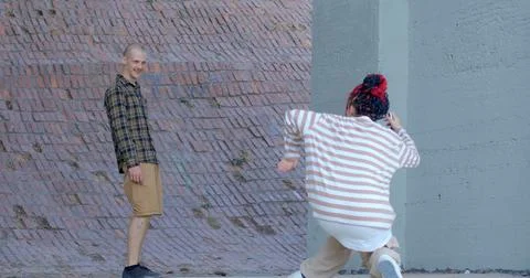 Young people engaged in process of learning and mastering new dance movements. Foto stock