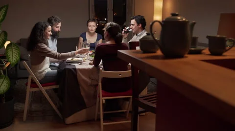 Young people enjoy a dinner Stock Footage 46485458