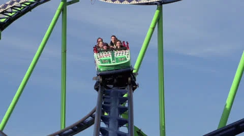 Young people on a funfair rollercoaster Stock Footage 22676691