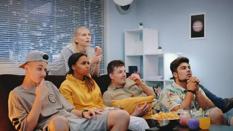 Young people getting sad with their sport team play watched on TV Stock Footage 155807591