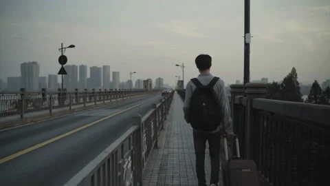 Young people go out to work, lonely figure walking on the bridge in the city. Stock Footage 172053312