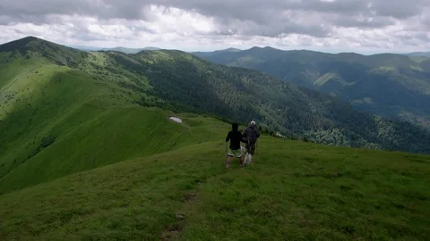 Young people with gogs Fox terrier hiking in mountains, travel, fitness or Stock-Footage 88908875