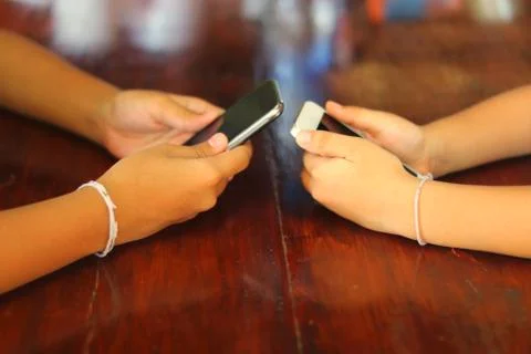 Young people hands using smart phones Stock Photos