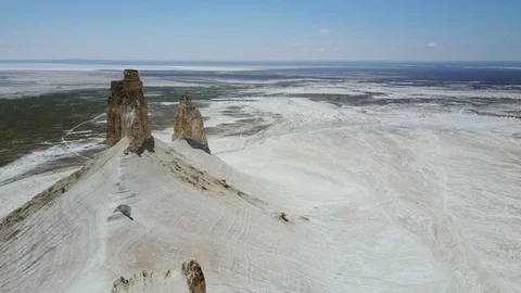 Young people having fun at the edge of a high cliff in a beautiful landscape Stock Footage 116390520