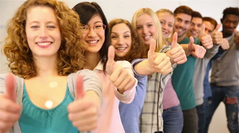 Young people holding thumbs up Video stock 33290544