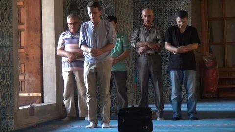 Young people inside the mosque praying Stock Footage 93028001